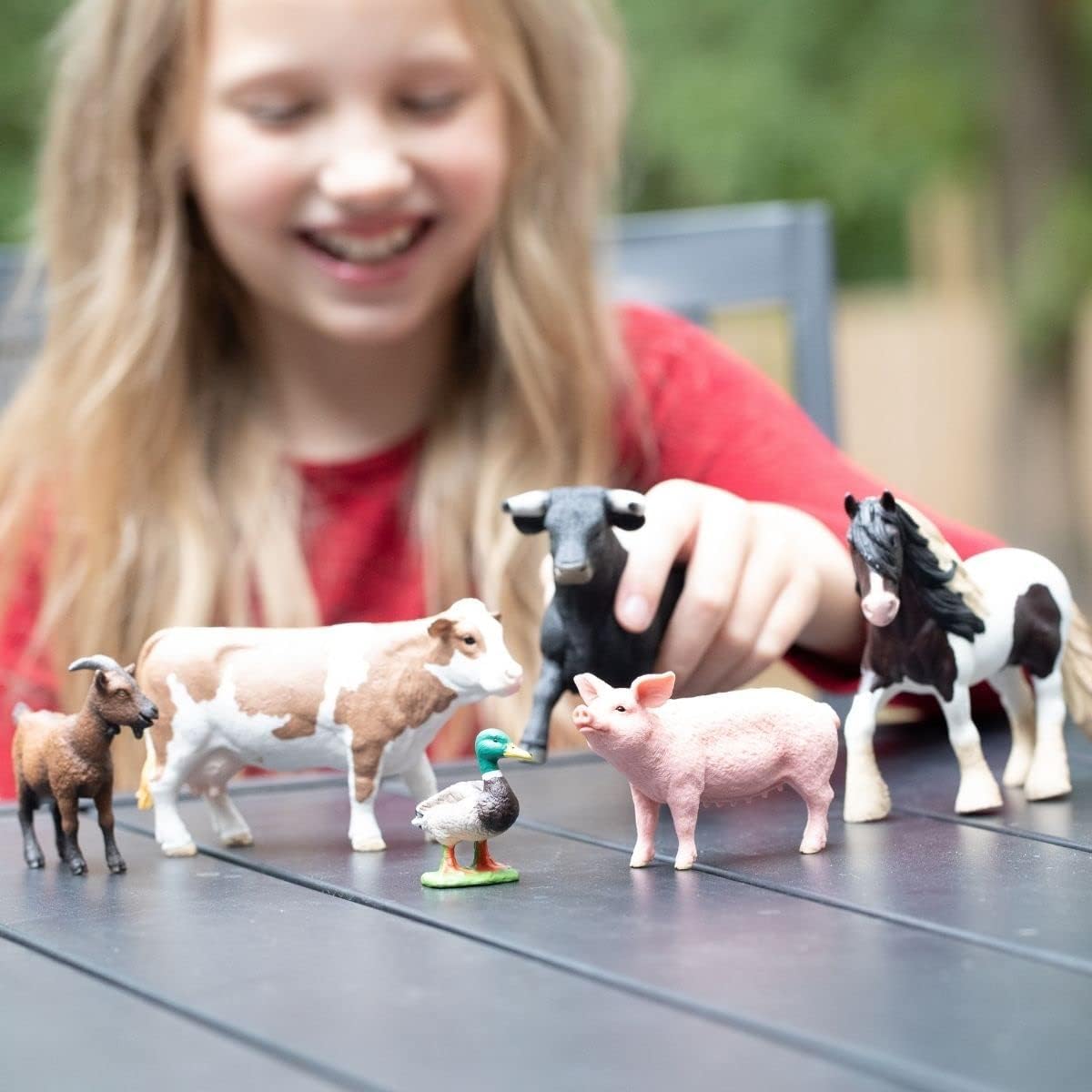 Schleich Farm World cow figurine promotes storytelling and fine-motor skills through pretend farming.