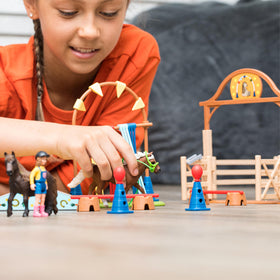 Schleich Farm World trainer figure guiding pony practice and lessons.