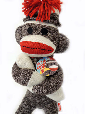 schylling sock monkey with hat and red pompom, nostalgic charm for display and play.