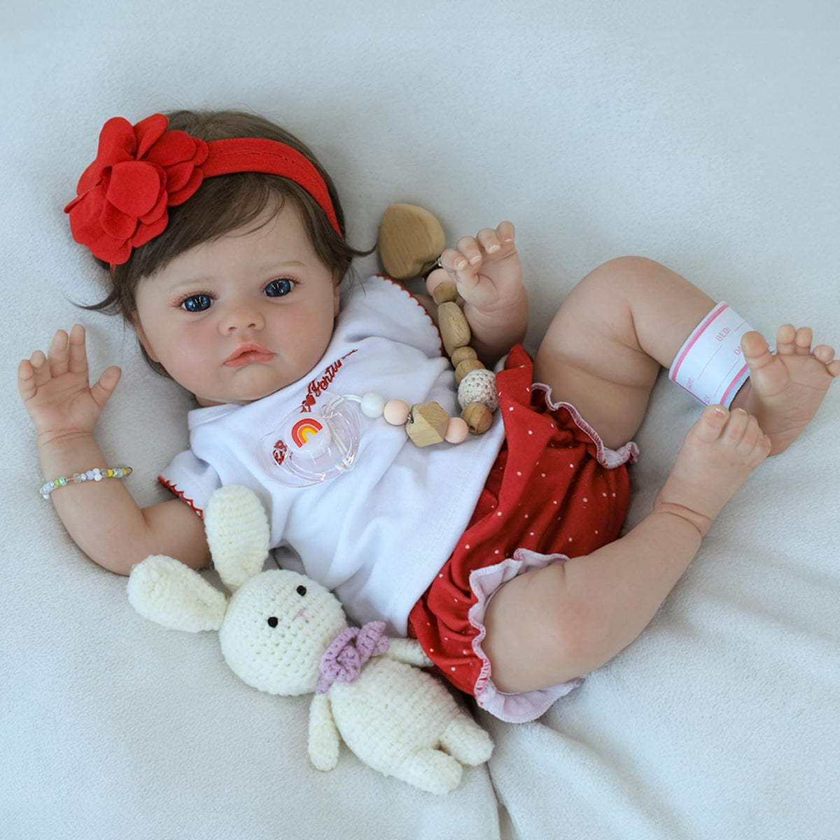 SCOM lifelike baby doll delicate folds on hands and feet.