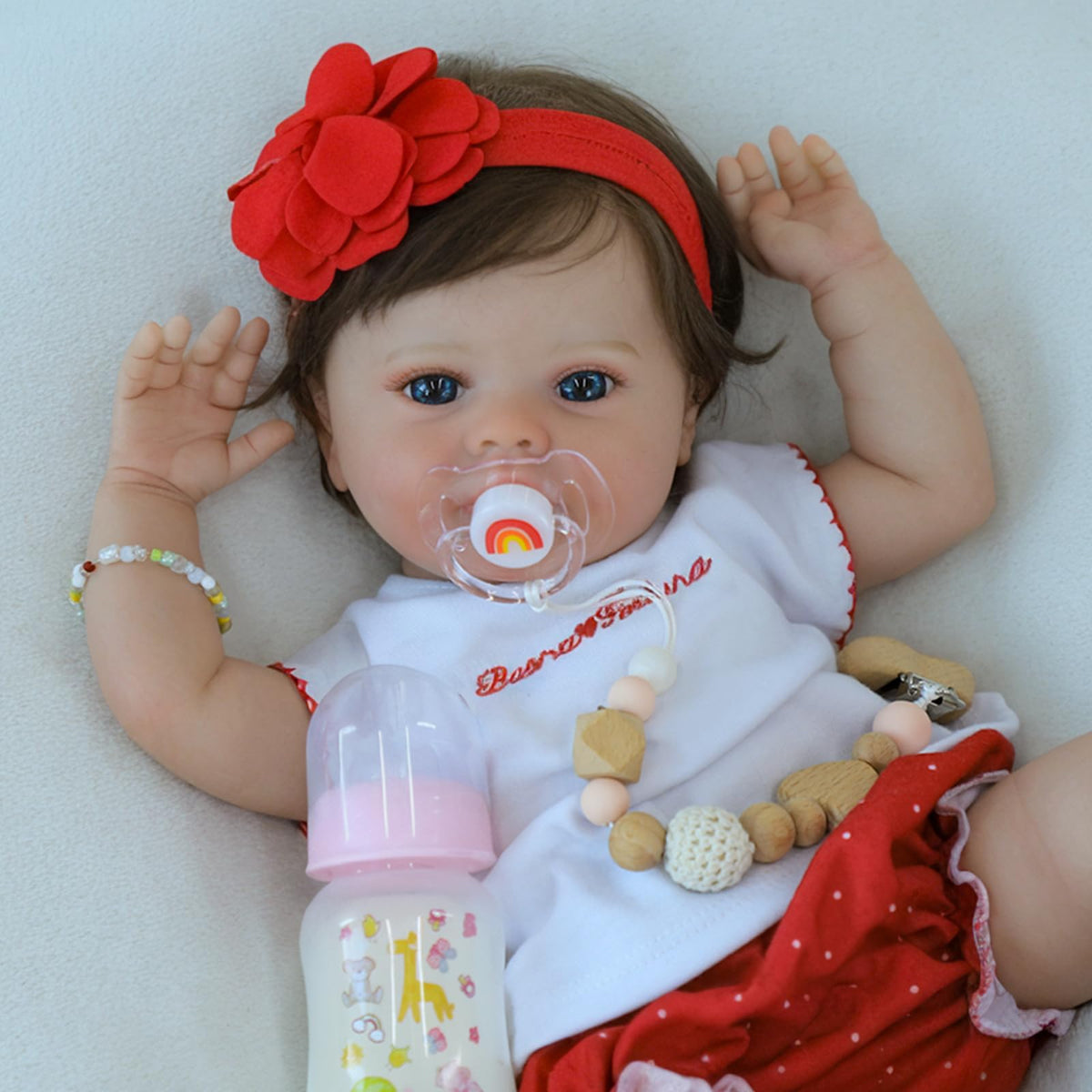 SCOM lifelike baby doll face close-up with blue eyes for realistic pretend play.