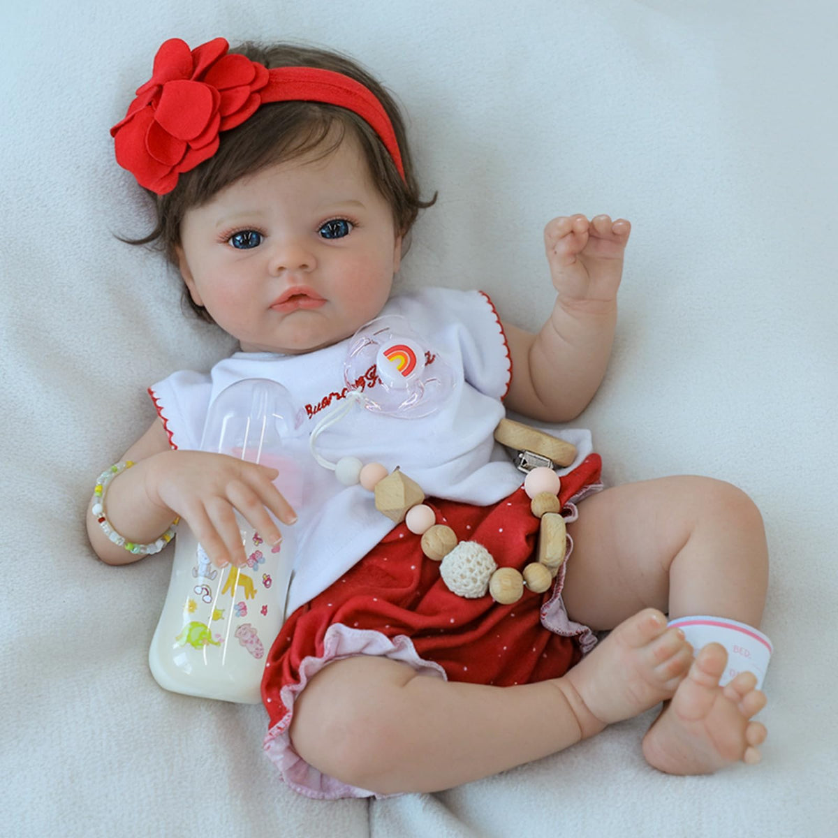SCOM lifelike baby doll flexible limbs for easy outfit changes.