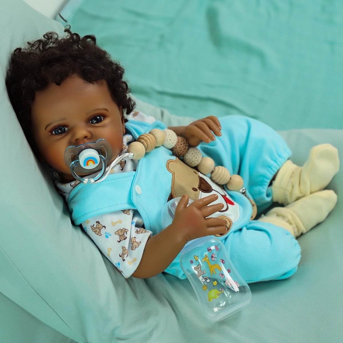 SCOM Quinbee bottle for nurturing feeding play and role-play scenarios.