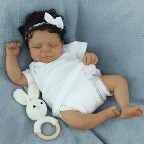 SCOM Reborn Baby Doll Black Boy in infant onesie for gentle play.
