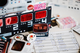 Scorpion Masqué Decrypto decoding screens and scrambled cards in use.