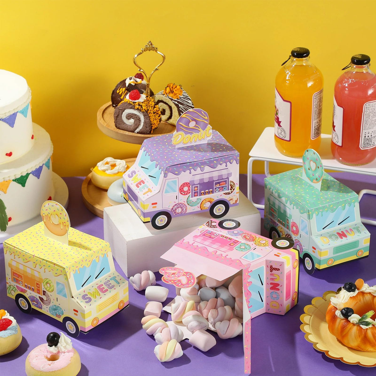 Seajan donut boxes enhance birthday and baby shower table decor.