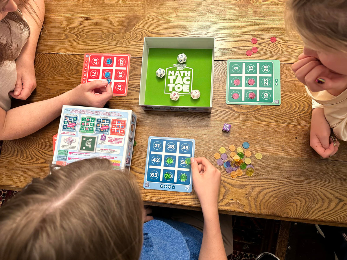 PlaySmart Dice and colorful chips ready for engaging math play.