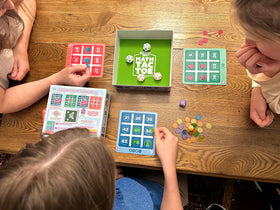 PlaySmart Dice and colorful chips ready for engaging math play.