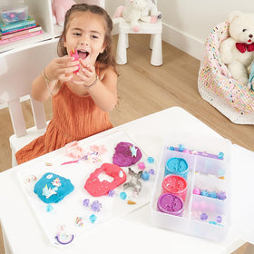 Sensationally OT kids playing with dough demonstrates tactile learning.
