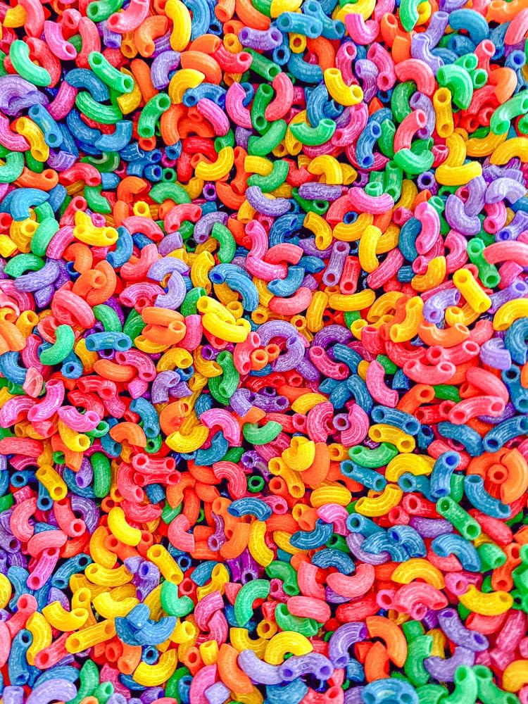 Sensory-N-Stuff rainbow elbow pasta stays vibrant and scent-free for mess-free play.