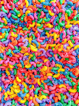 Sensory-N-Stuff rainbow elbow pasta stays vibrant and scent-free for mess-free play.