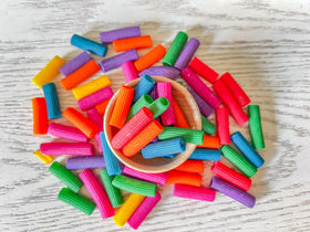 Rainbow Pasta strands ready to be threaded into necklaces for dry play