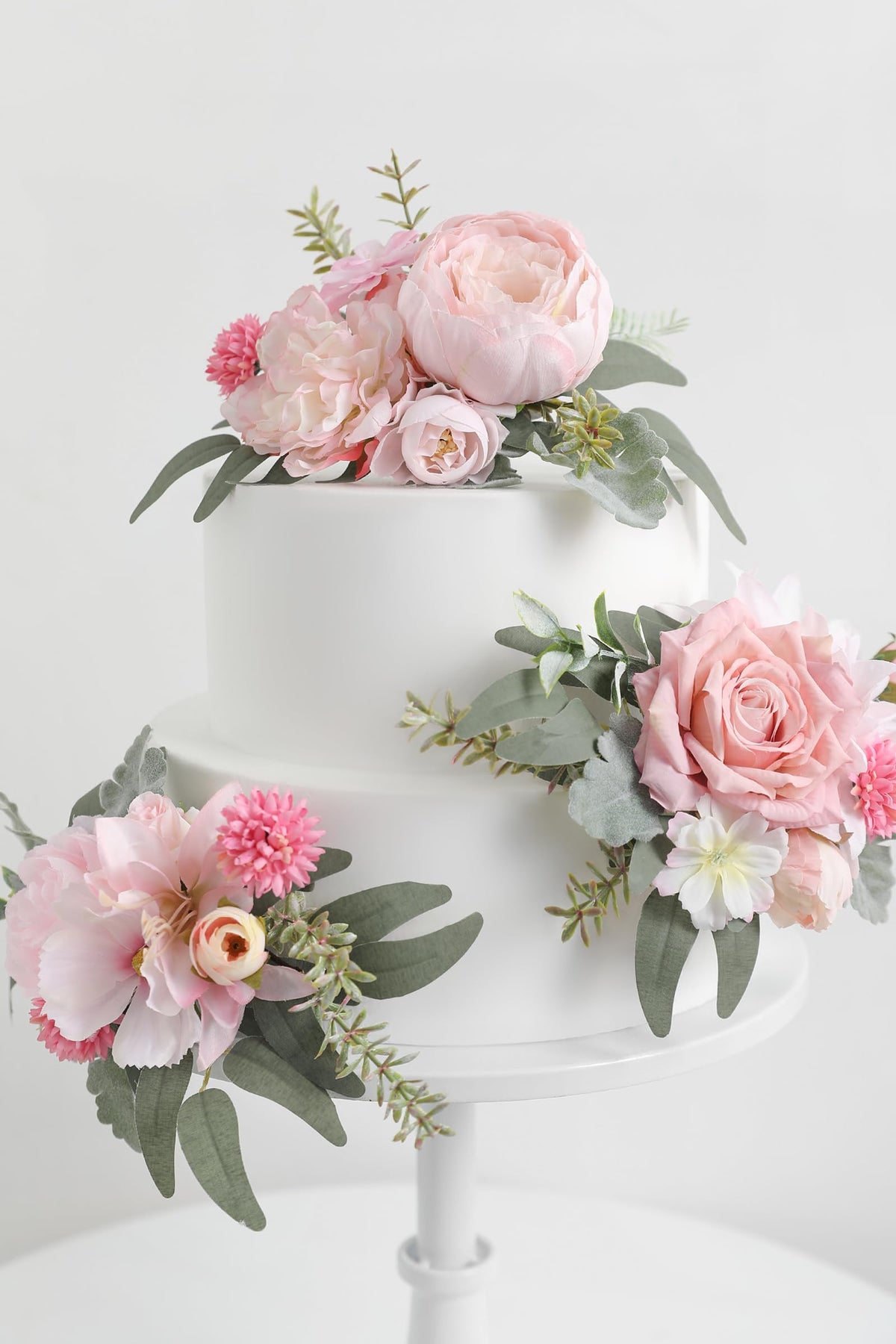 Serra Flora pink rose hydrangea topper enhances cake aesthetics for romantic celebrations.