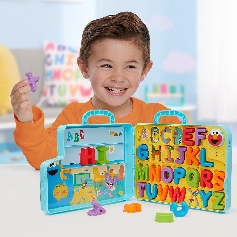 Opened Elmo's Learning Letters Bus showing 26 removable letters.