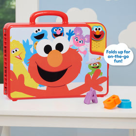 Elmo's button activates phrases and a song for alphabet learning.