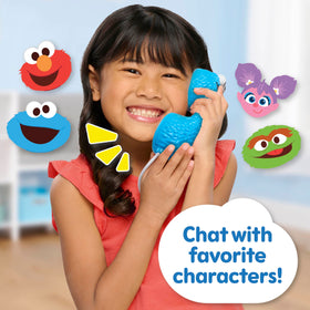 Sesame Street Elmo’s Sing & Learn Playphone keypad lit up for interactive play and motor practice