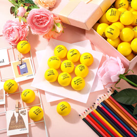 Shappy yellow stress ball held in hand during work to reduce anxiety.