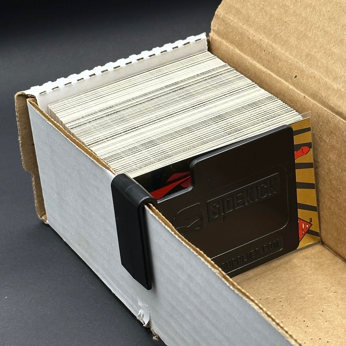 SIDEKICK Mini Card Box Divider grips cardboard walls for secure storage.
