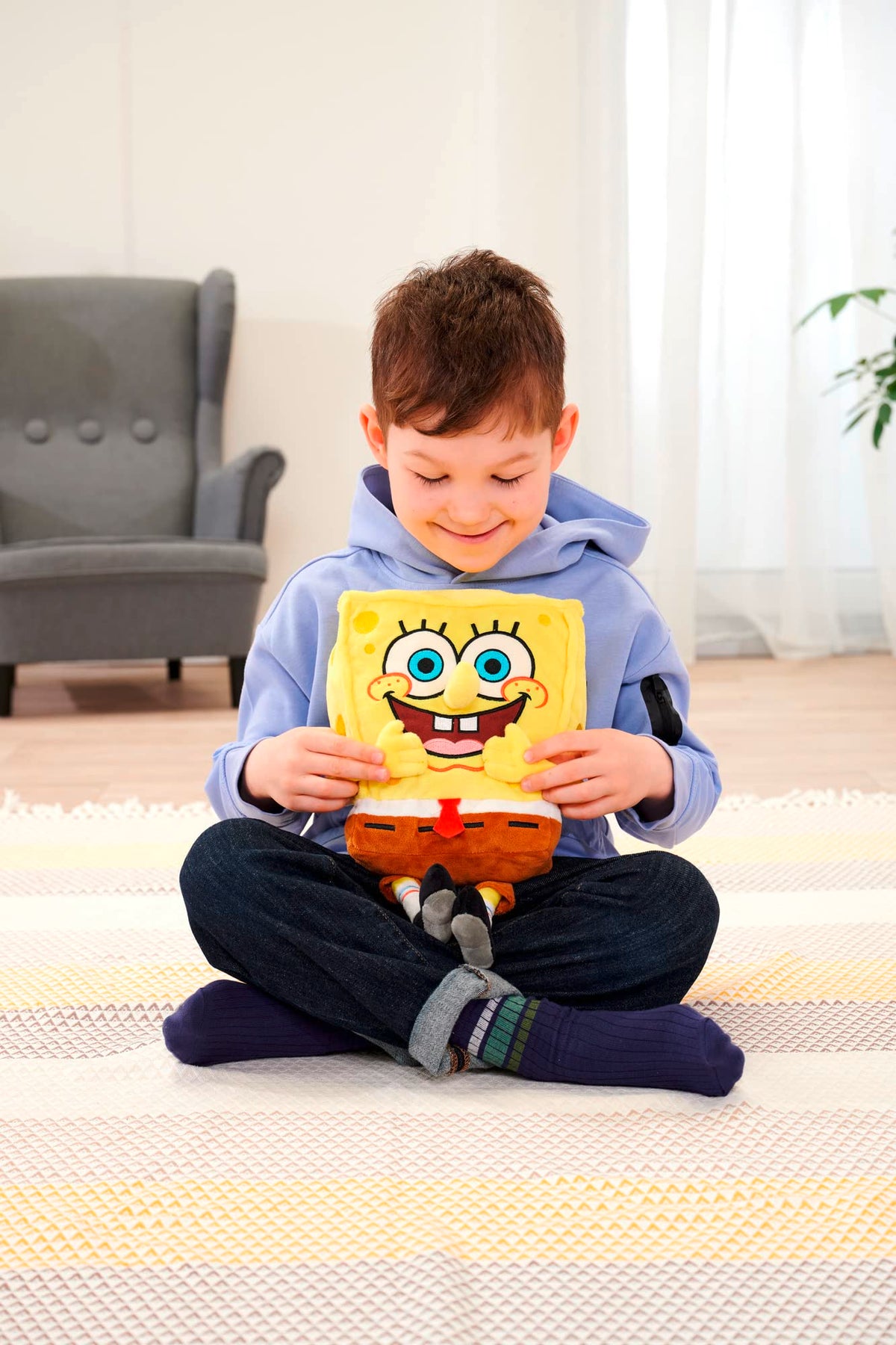 Bright yellow Simba SpongeBob plush adds cheerful color to playtime.