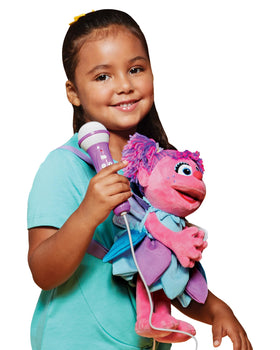 Singing Machine Abby Cadabby plush karaoke toy close-up portrait for kids' sing-alongs.