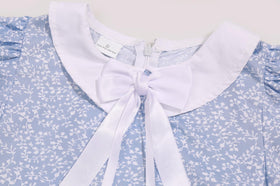 SIZGAROOT colonial bonnet complements the dress with classic sleeve details.