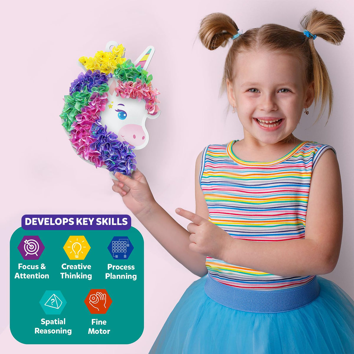 Skillmatics Poke-in Art unicorn dream decor hanging on a rainbow backdrop for bright room decor.