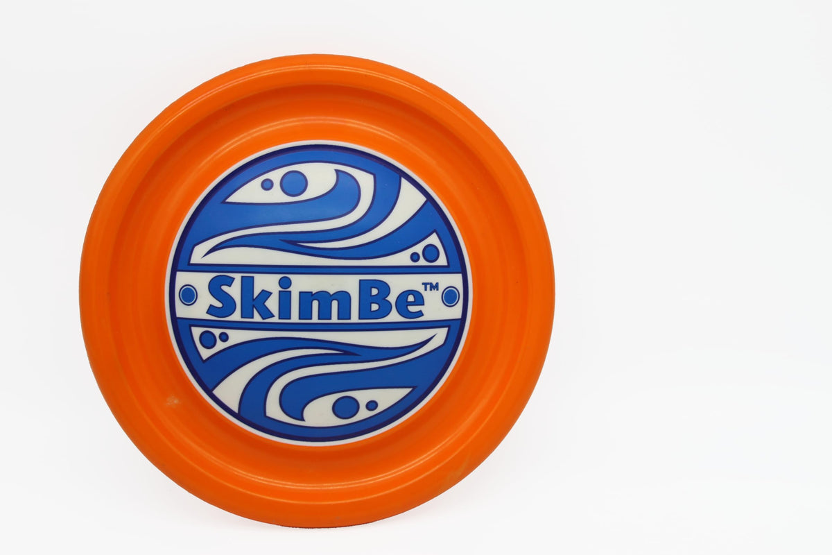 SkimBe Disc Toy poolside view showing bright colors for easy visibility and fun.