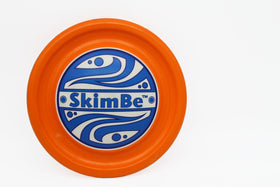 SkimBe Disc Toy poolside view showing bright colors for easy visibility and fun.