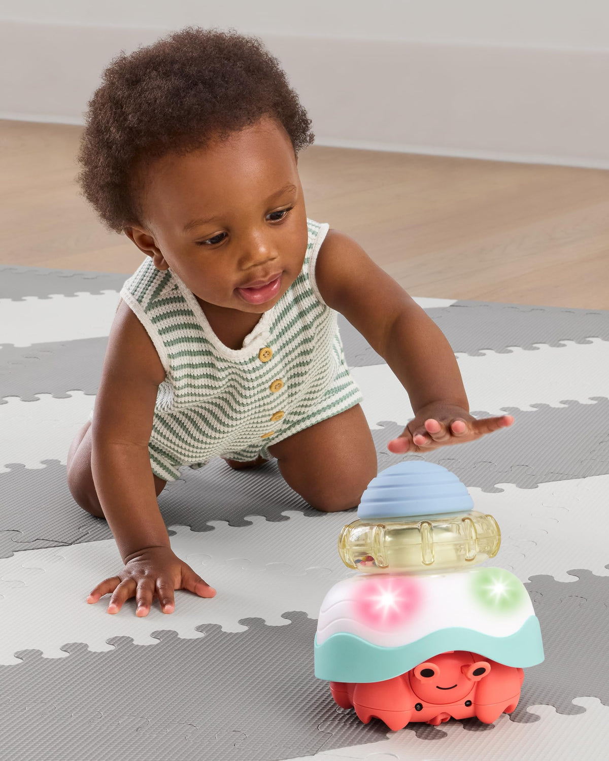 Skip Hop crab crawl toy circular motion promotes chasing and motor skill development.