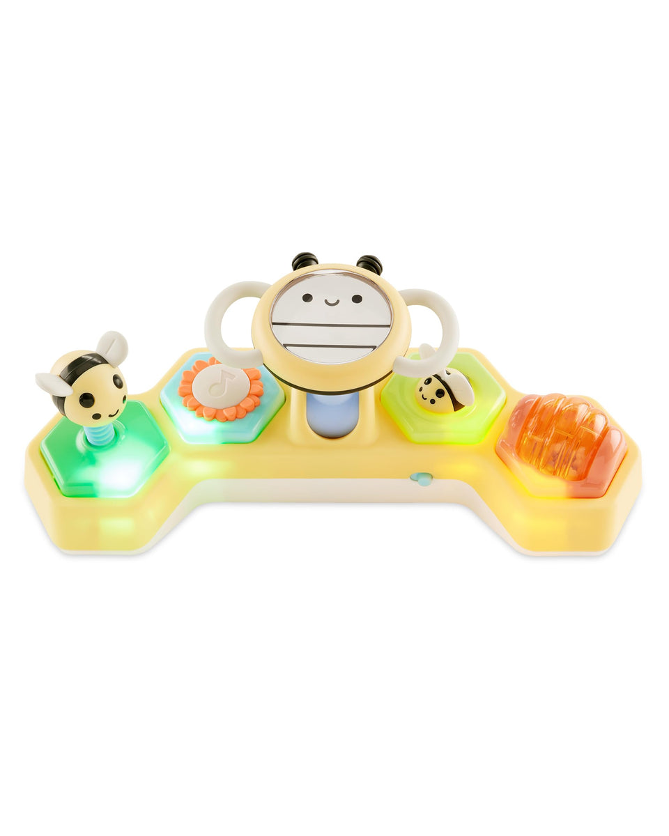 Skip Hop Farmstand See & Bee steering wheel during tummy time supports neck and core exploration.
