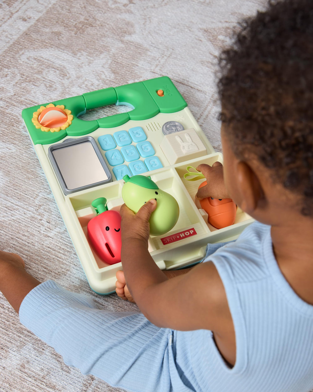 Skip Hop removable play panel doubles as floor activity or easel