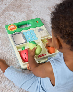 Skip Hop removable play panel doubles as floor activity or easel