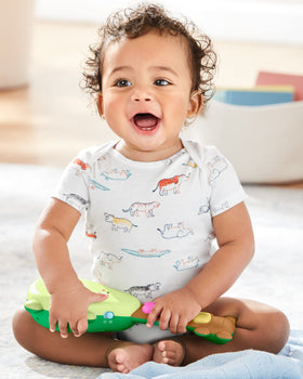 Skip Hop Rock-A-Mole Guitar fits tiny hands for easy grip during play.