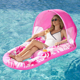 Sloosh inflatable pool lounger in pink tropical leaves for stylish poolside lounging
