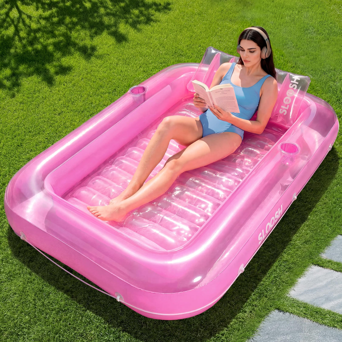 SLOOSH inflatable tanning pool lounger in pink ready for sunbathing and relaxation