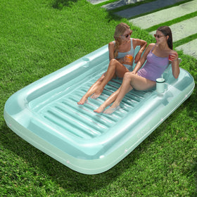 Sloosh inflatable tanning pool lounger in cyan offers a spacious shared sunbathing surface.
