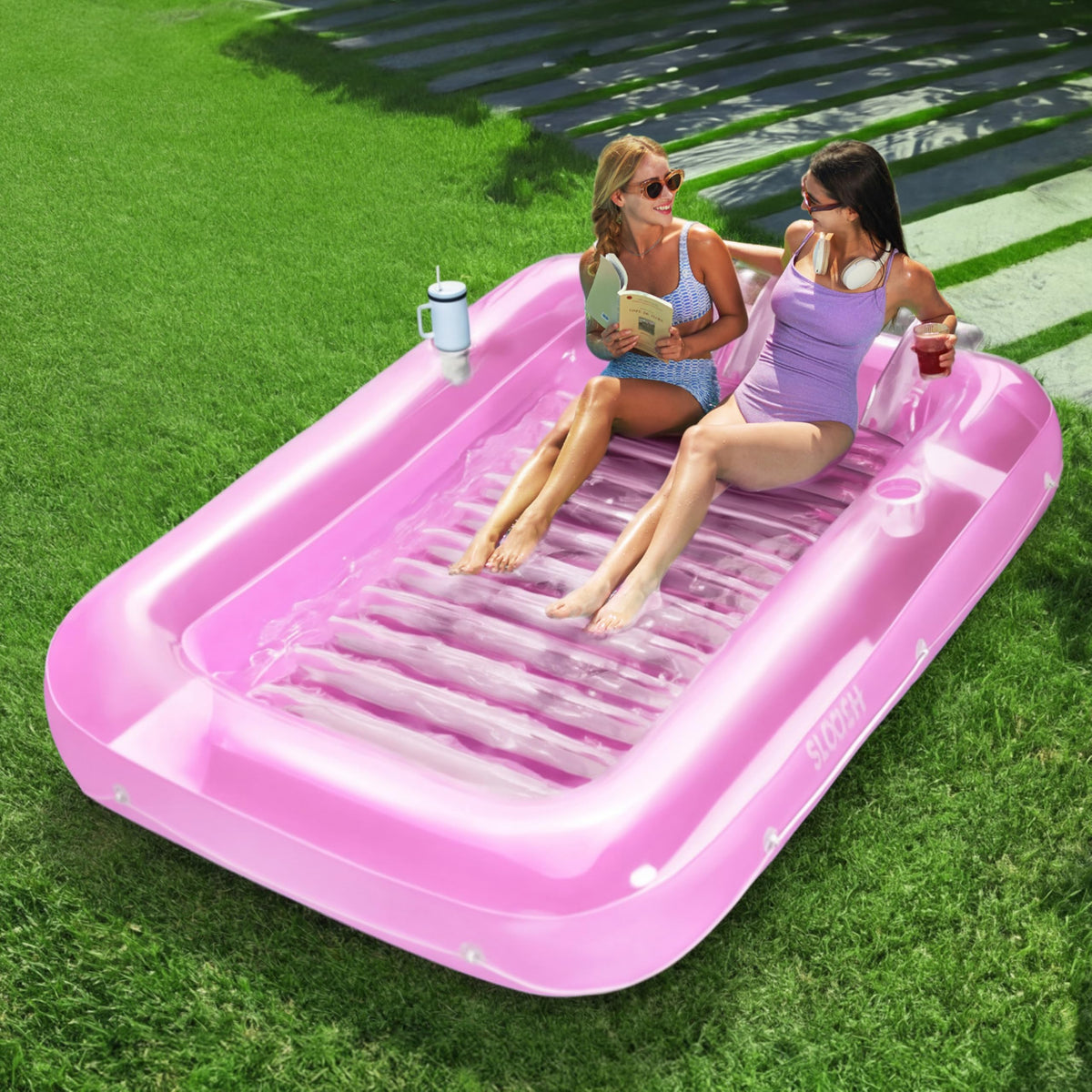 Sloosh inflatable tanning pool lounger with 85x57 surface for shared sunbathing in pink and white
