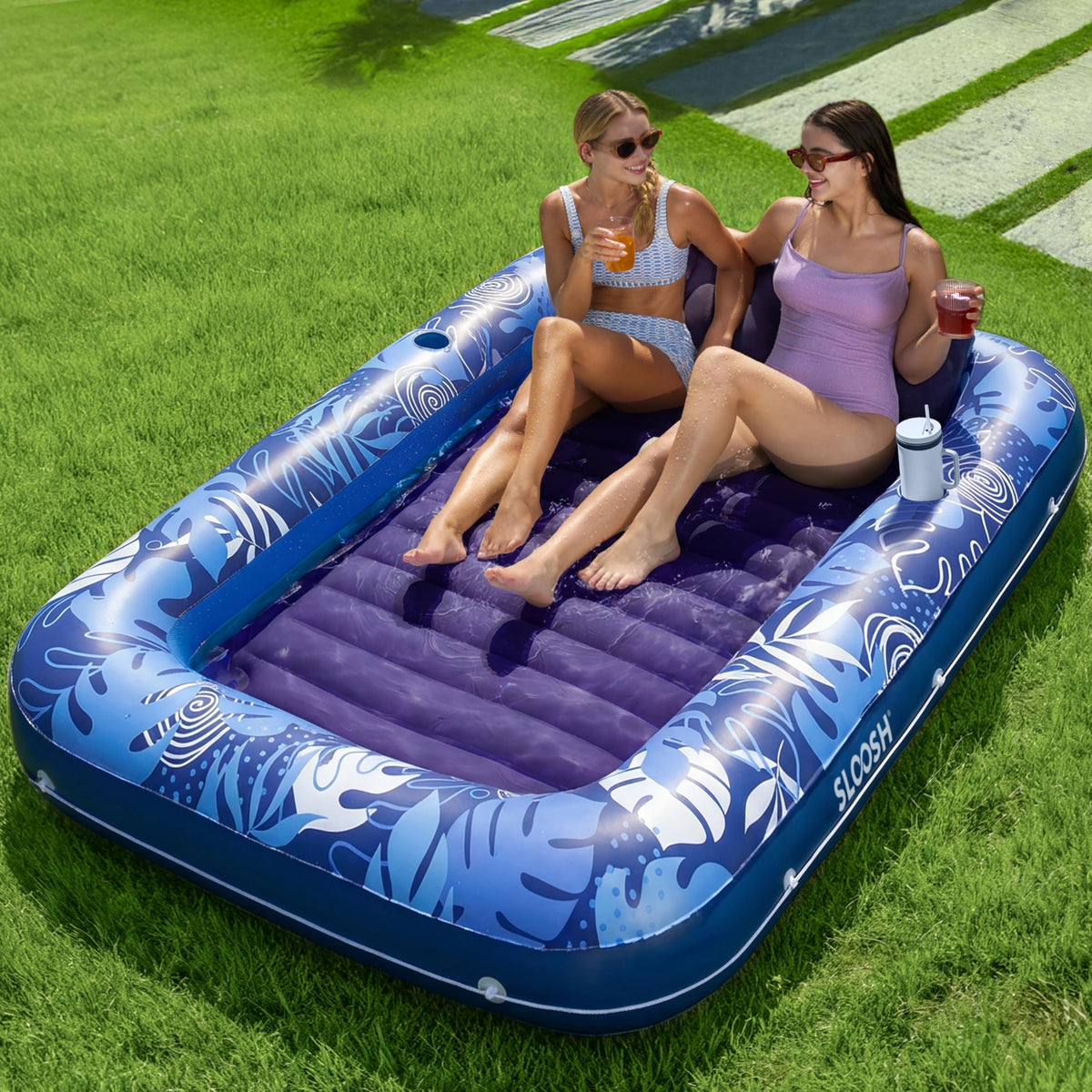 Sloosh inflatable tanning pool lounger with pillow offers comfortable shared sunbathing.
