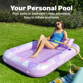 Purple Sloosh tanning float with two drink holders for backyard relaxation