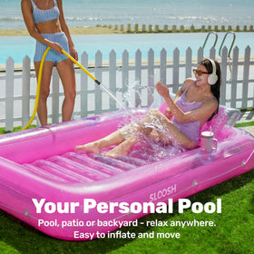 Sloosh pink lounger includes two drink holders for poolside refreshments.