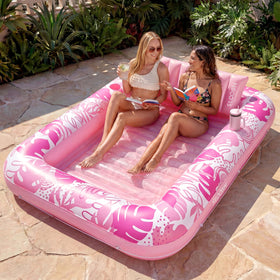 Sloosh XL inflatable tanning pool lounger with two-person capacity perfect for backyard sunbathing.
