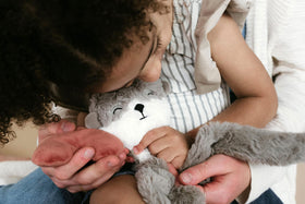 Slumberkins Snuggler fabric texture close-up highlights premium plush feel.