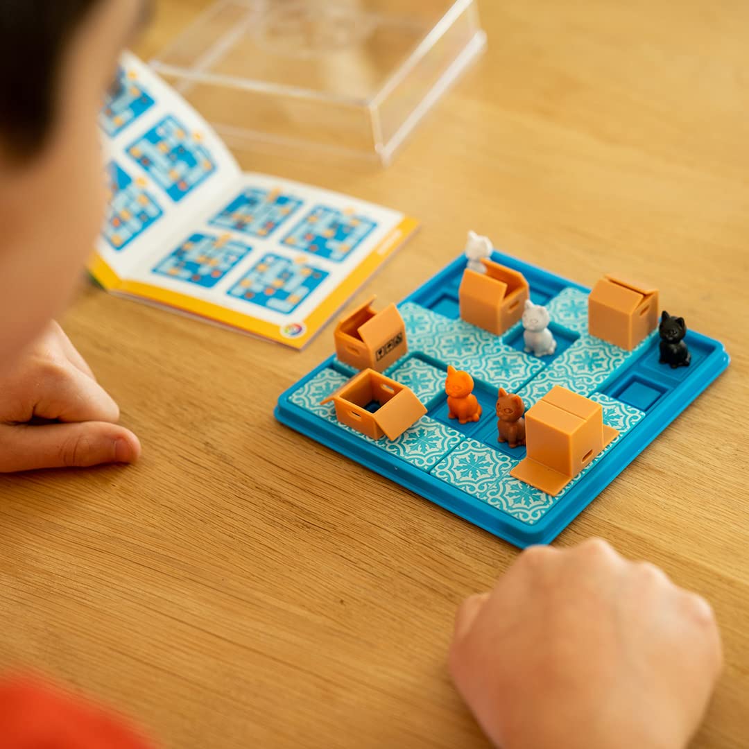 SmartGames Cats and Boxes cat pieces arranged to solve a challenge.