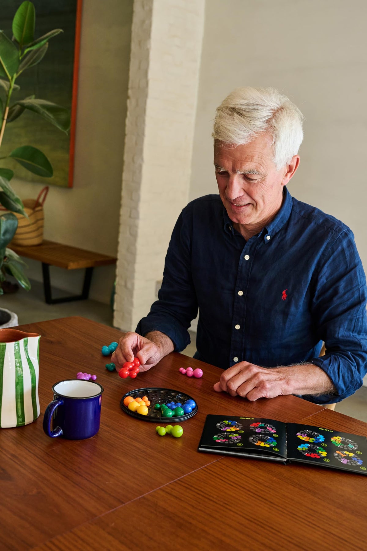 SmartGames IQ Deluxe Circle in-use scene demonstrates focused thinking.