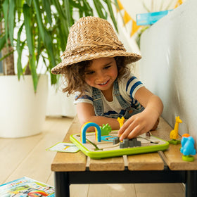 SmartGames Safari Park Jr. puzzle board shows where to place animals for each challenge.