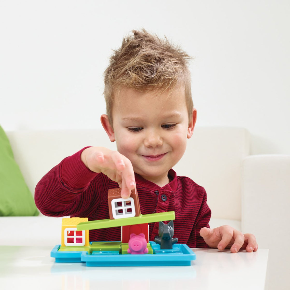 SmartGames Three Little Piggies puzzle pieces arranged for early problem-solving