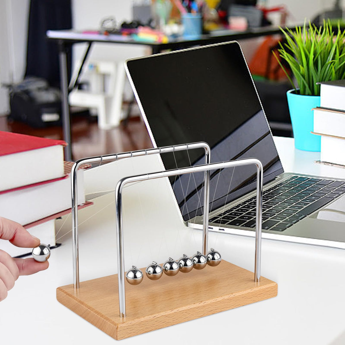 Smilesorg Newton's Cradle close-up swing captures smooth motion and tactile satisfaction.