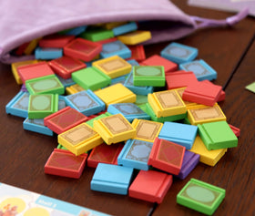 Smirk & Dagger village board and tokens support strategic movement.