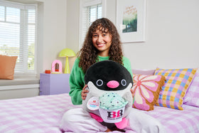 Snackles capybara boba plush on shelf showcases collectible charm