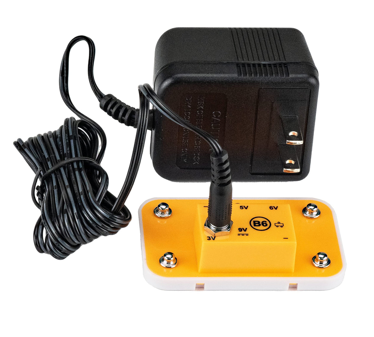 Adapter plugged into outlet near the Snap Circuits board.